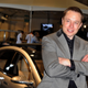 Elon Musk stands in front of a Model S in 2009